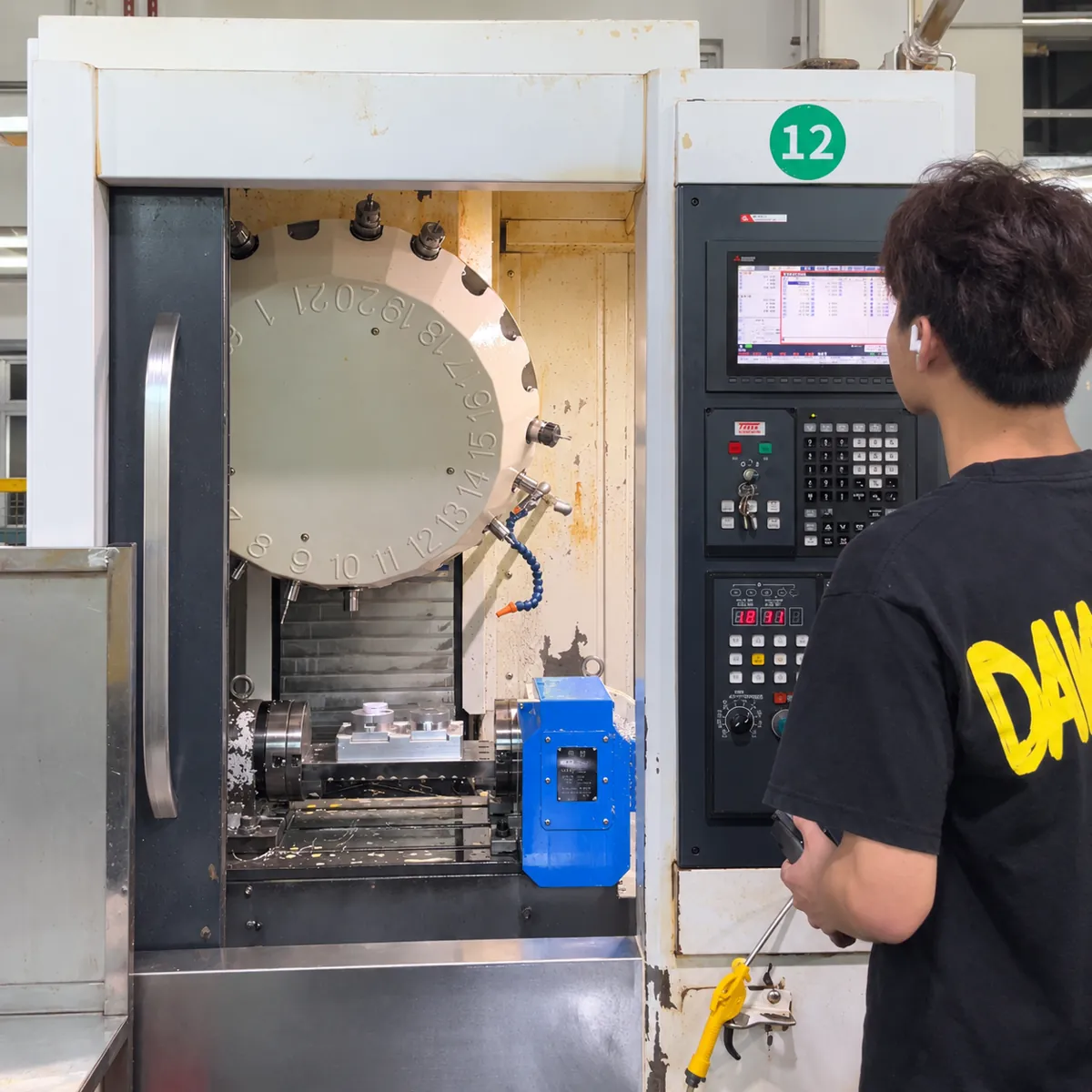 Operator at a CNC machining center
